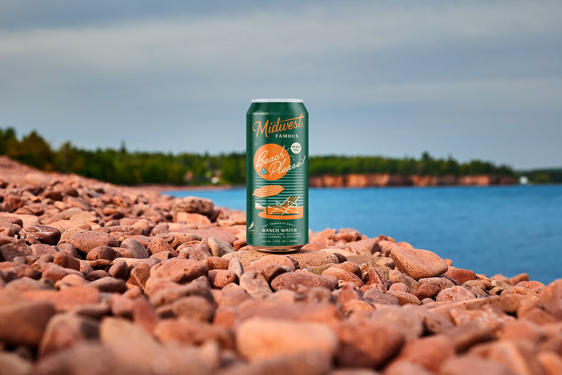 a green can of thc ranch water on a rocky beach