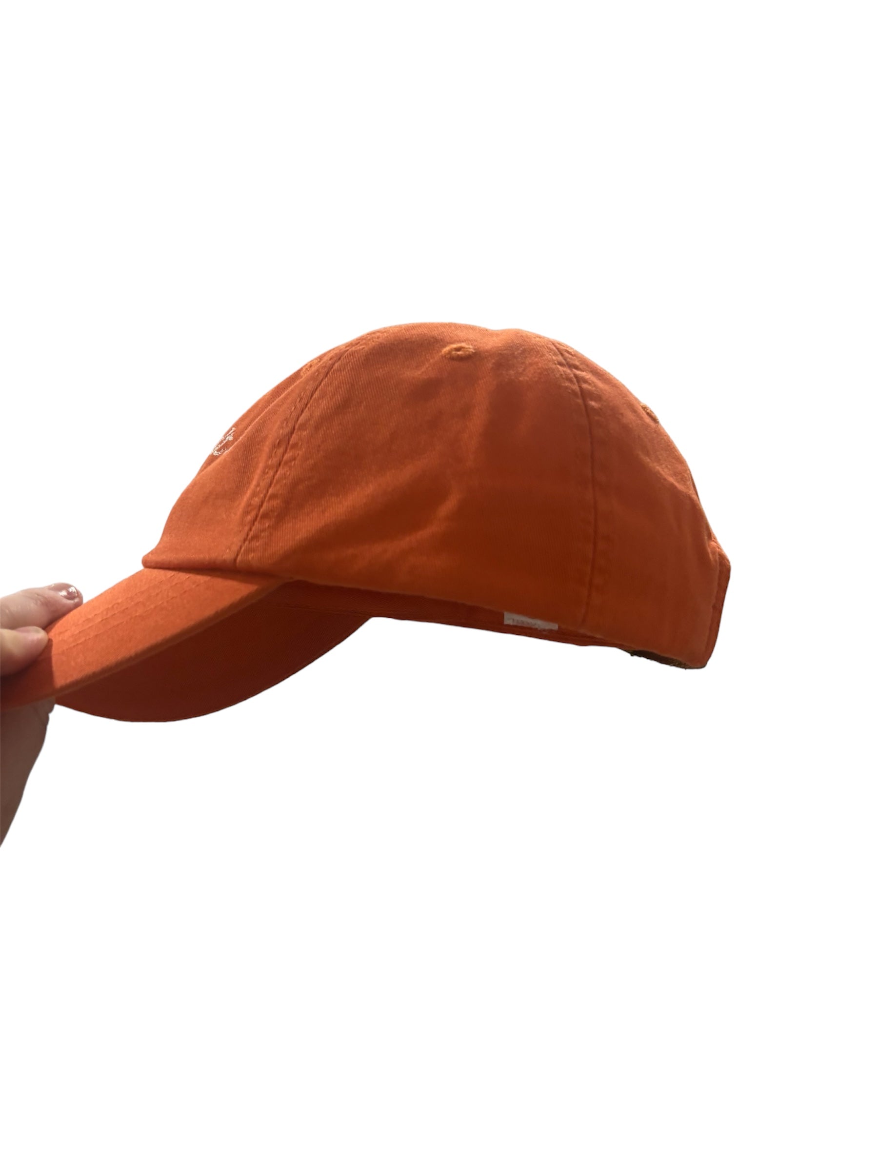 an orange baseball cap