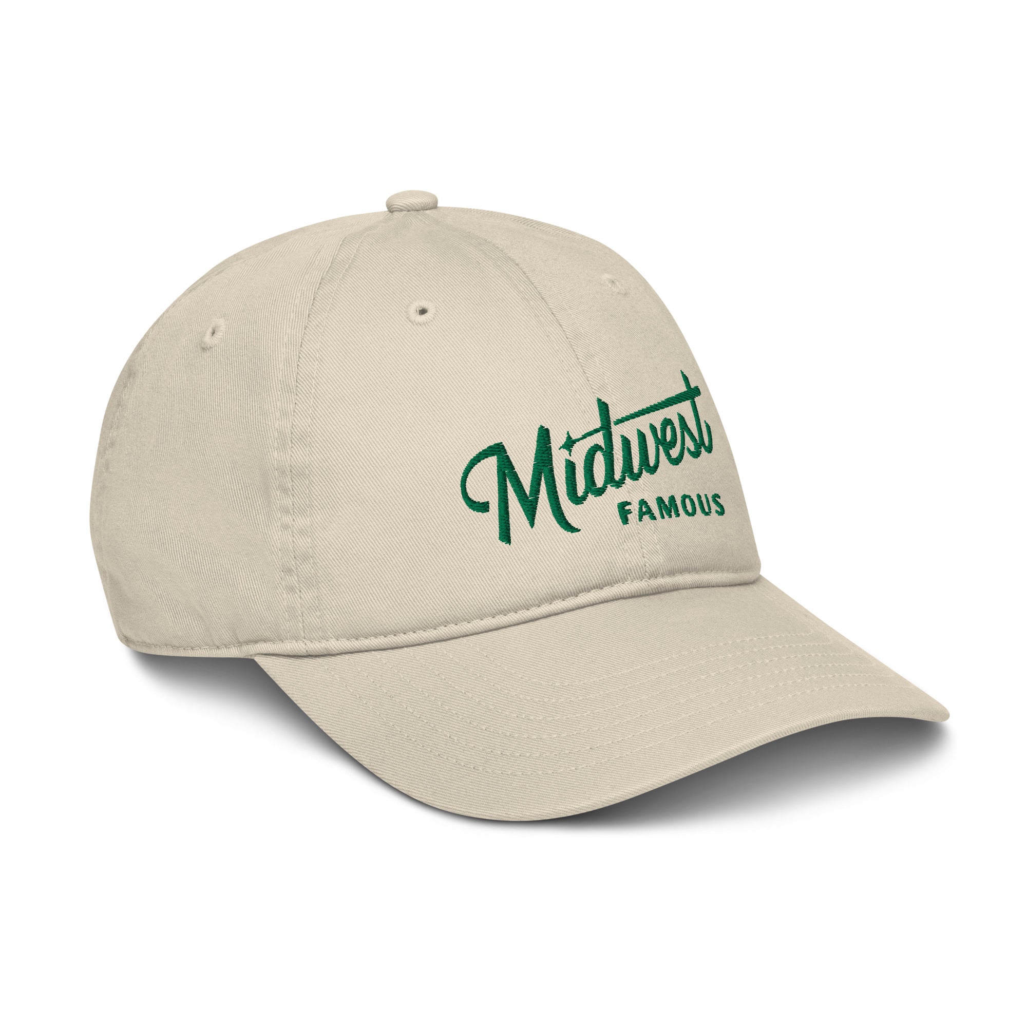 a tan baseball cap with a green logo