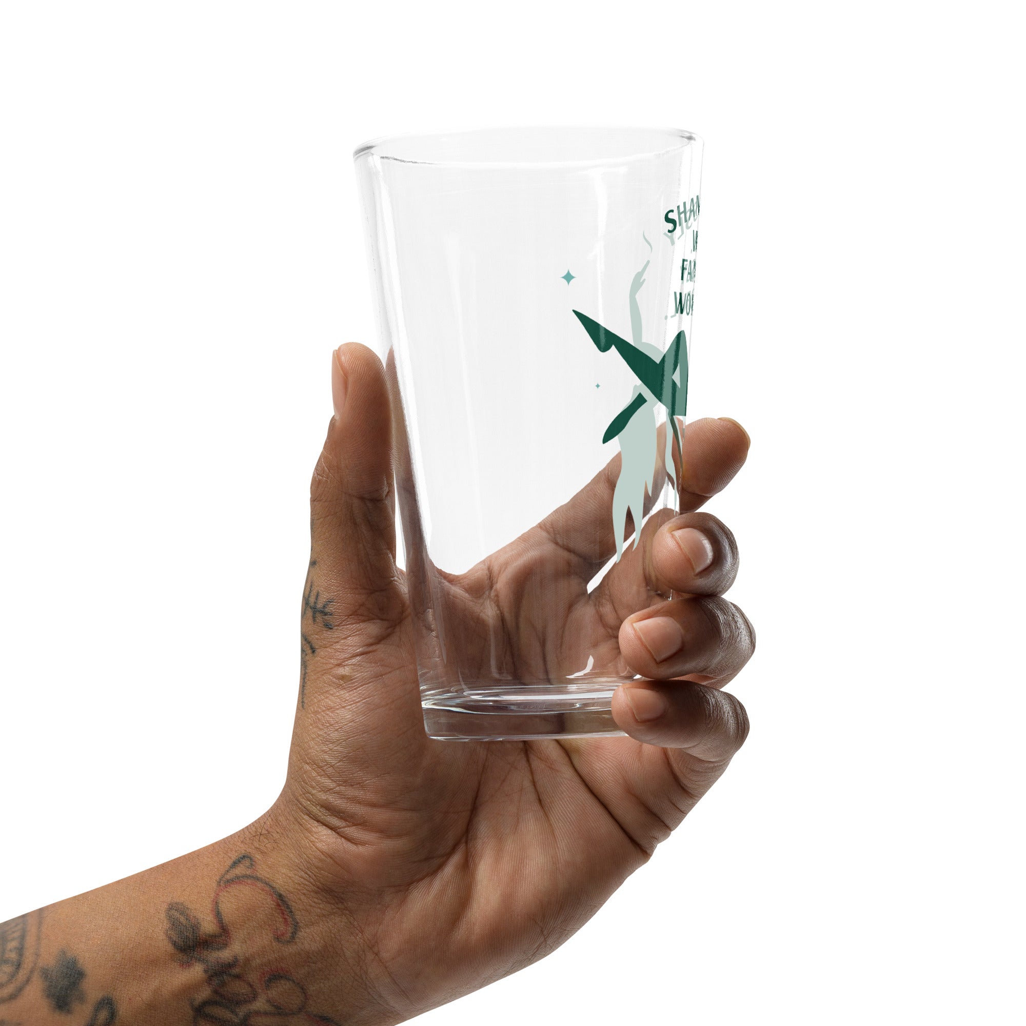 a pint glass with a green logo in someone's hand