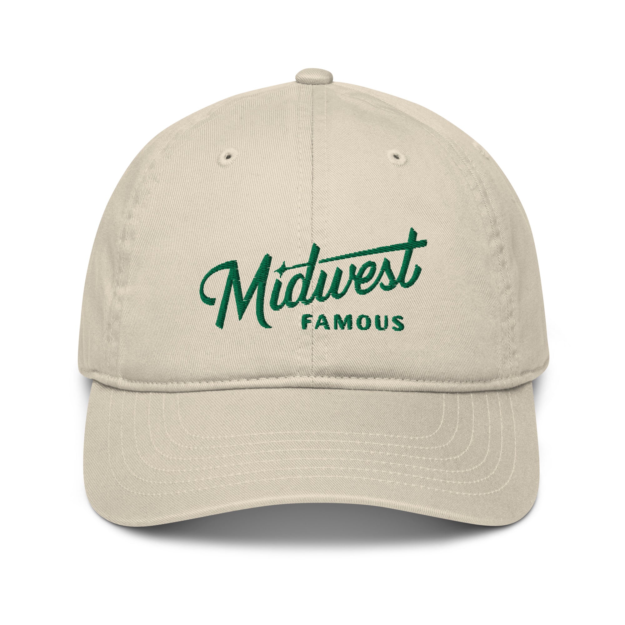 a tan baseball cap with a green logo